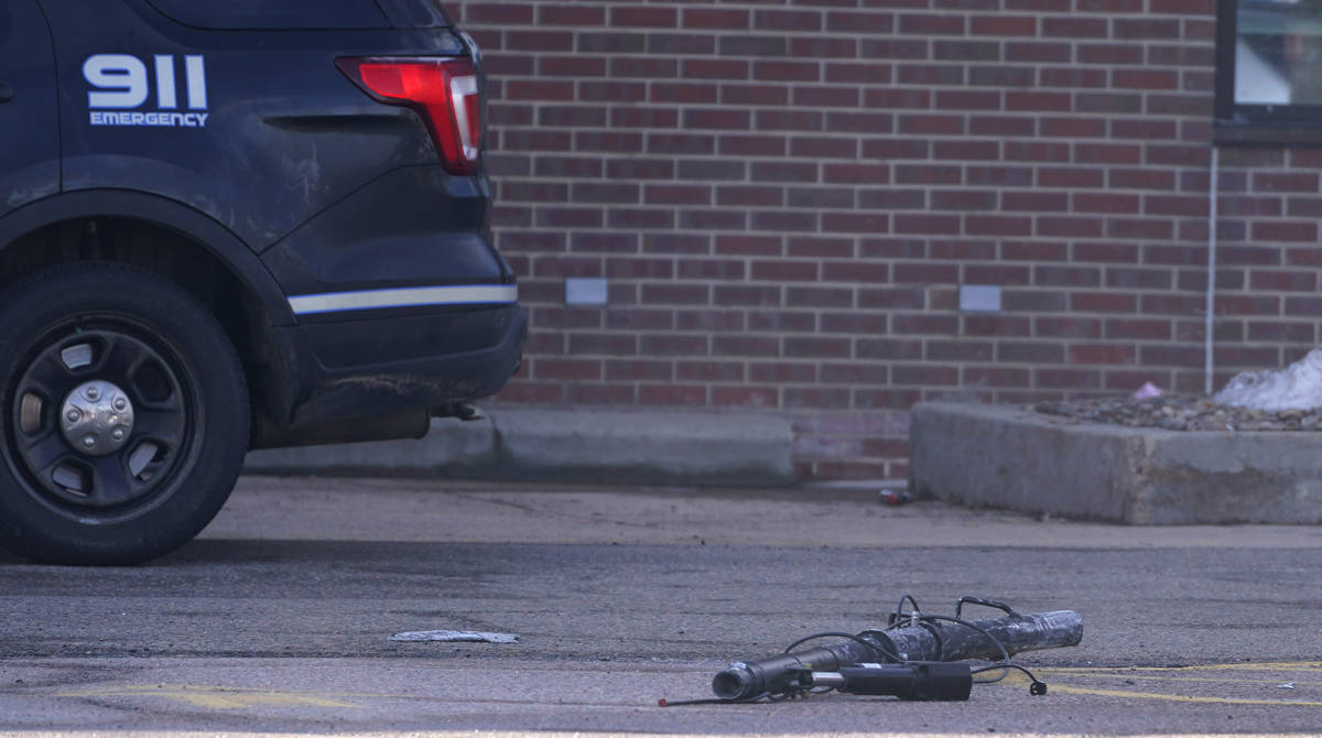 Debris lies in the parking lot outside a King Soopers grocery store where a mass shooting took ...