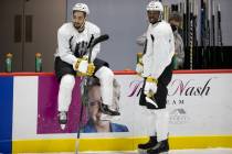 The Henderson Silver Knights' Tyrell Goulbourne (12) chats with Jermaine Loewen (54) during a t ...