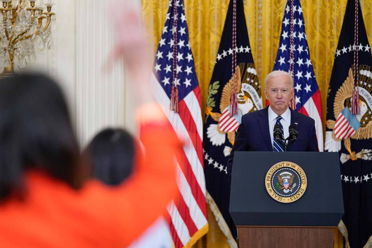 President Joe Biden speaks during a news conference in the East Room of the White House, Thursd ...
