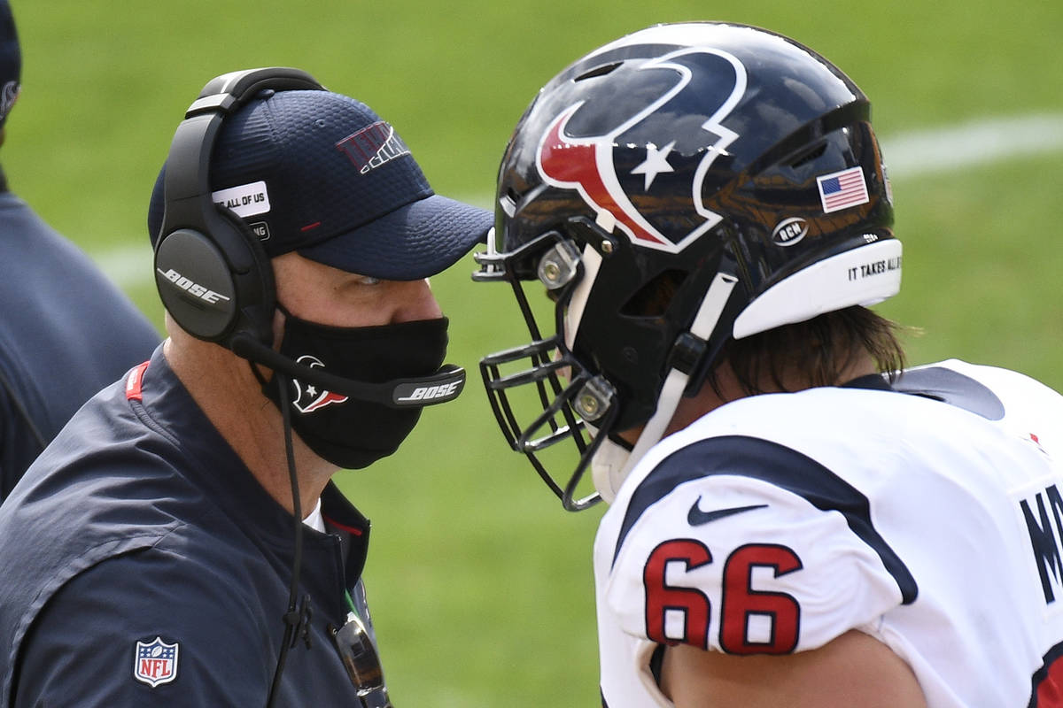 Houston Texans head coach Bill O'Brien, left, talks with center Nick Martin (66) on the sidelin ...