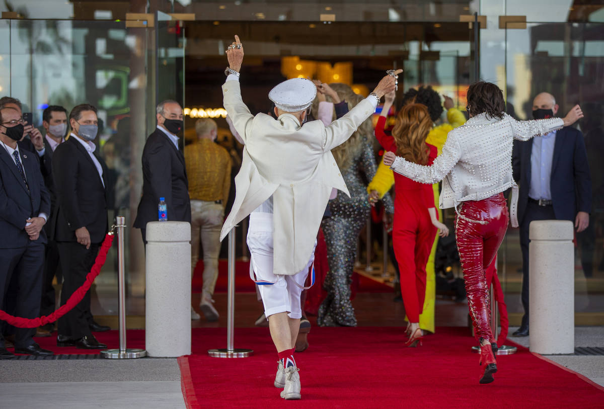 Dancers move up the red carpet and into the venue during the Virgin Hotels Las Vegas opening ce ...