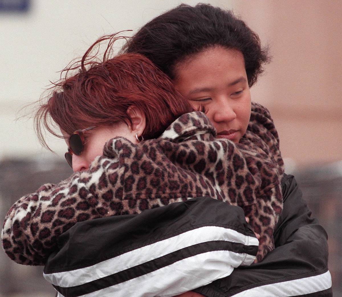 Two unidentified Albertson's employees hug outside the store on Friday, June 4,1999, in Las Veg ...