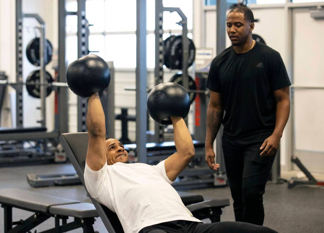 Las Vegas Raiders safety Johnathan Abram works out with Deon Hodges, human performance speciali ...
