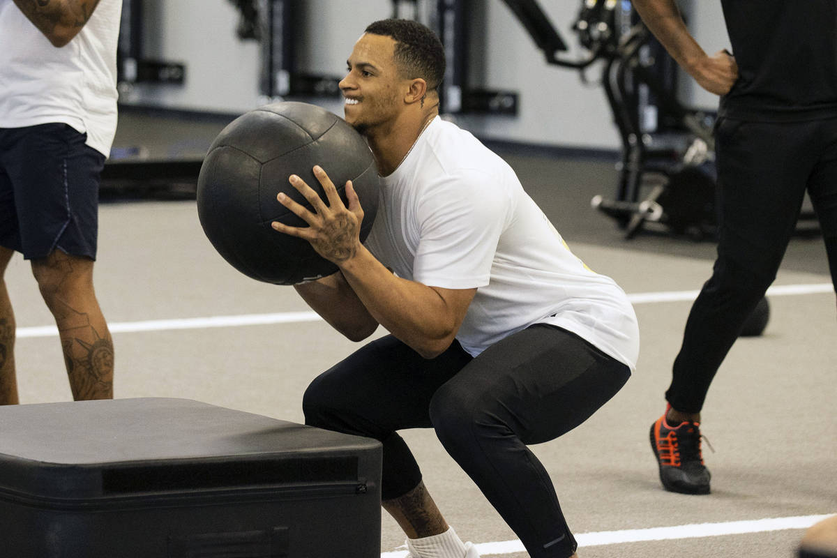 Las Vegas Raiders cornerback Keisean Nixon, left, and safety Johnathan Abram work out with Deon ...