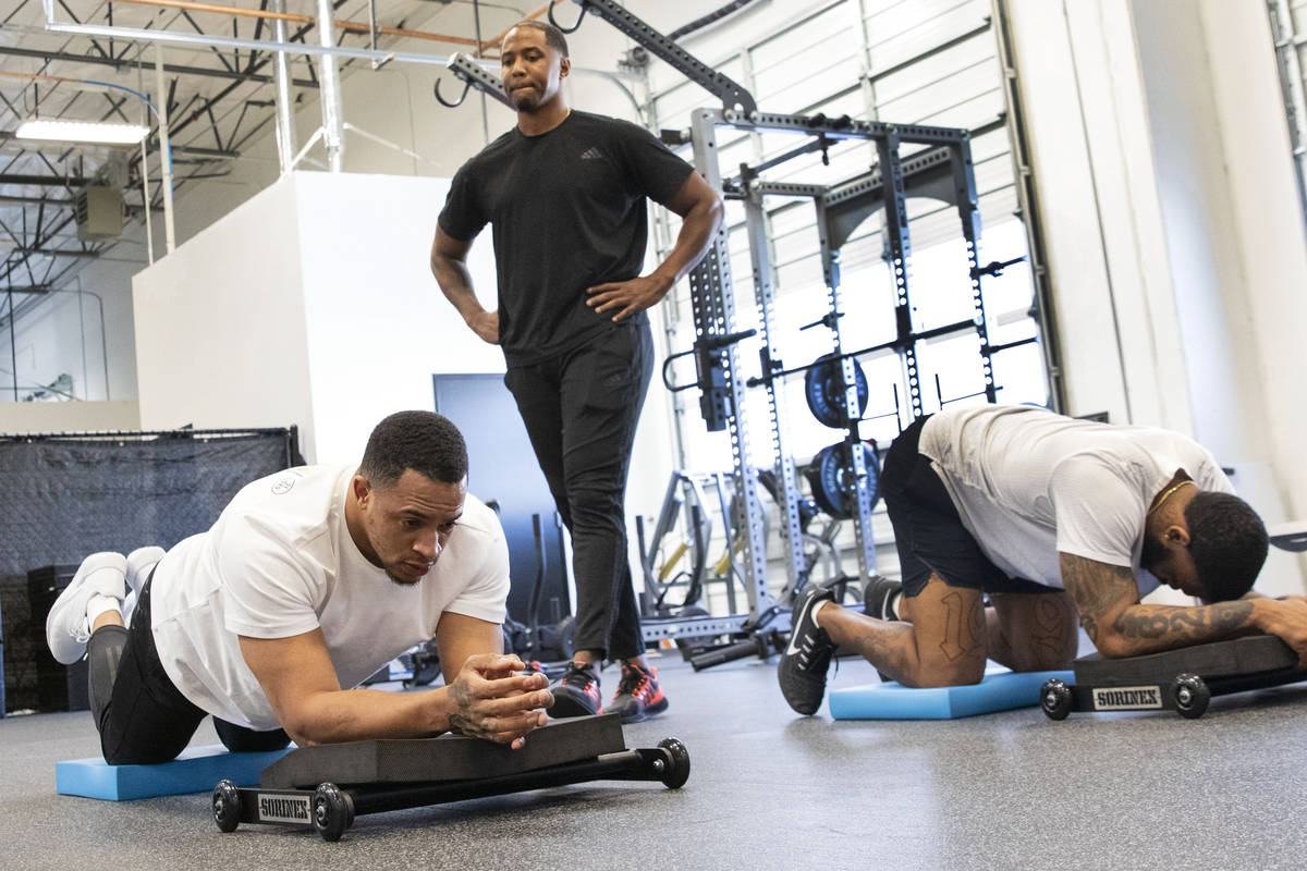 Las Vegas Raiders safety Johnathan Abram, left and cornerback Keisean Nixon workout with Deon H ...