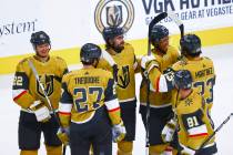 Golden Knights' Keegan Kolesar, center right, celebrates with teammates after a hockey game whe ...