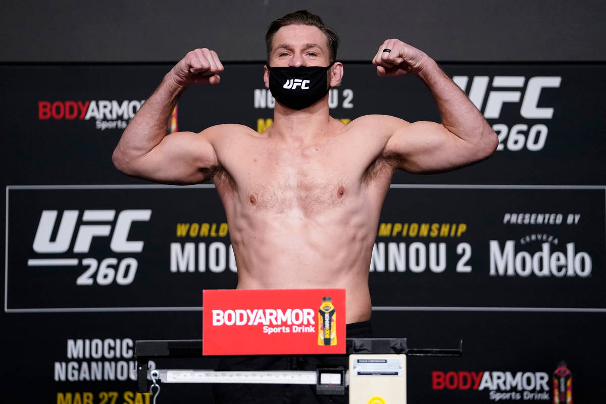 Stipe Miocic poses on the scale during the UFC 260 weigh-in at UFC APEX on March 26, 2021 in La ...