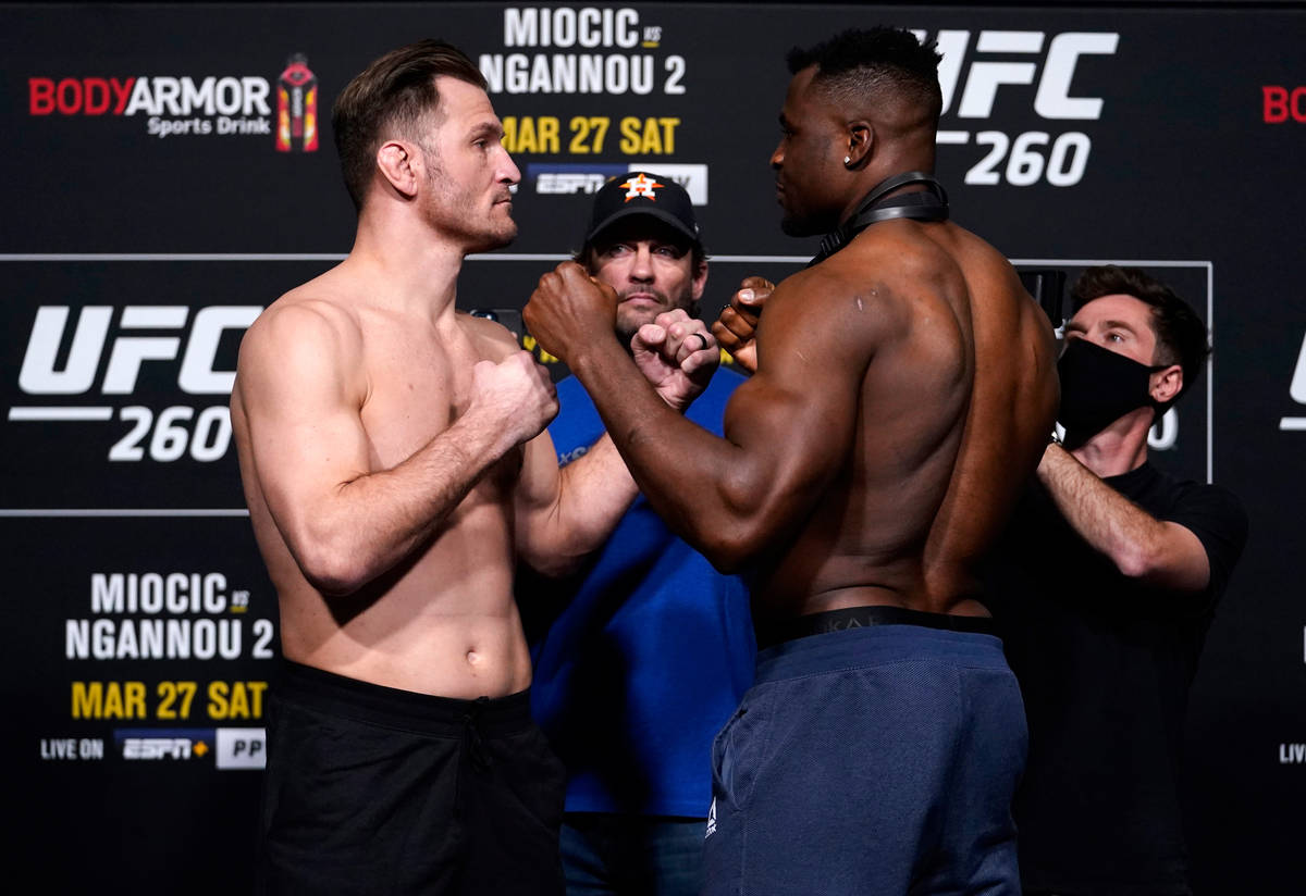 (L-R) Opponents Stipe Miocic and Francis Ngannou of Cameroon face off during the UFC 260 weigh- ...