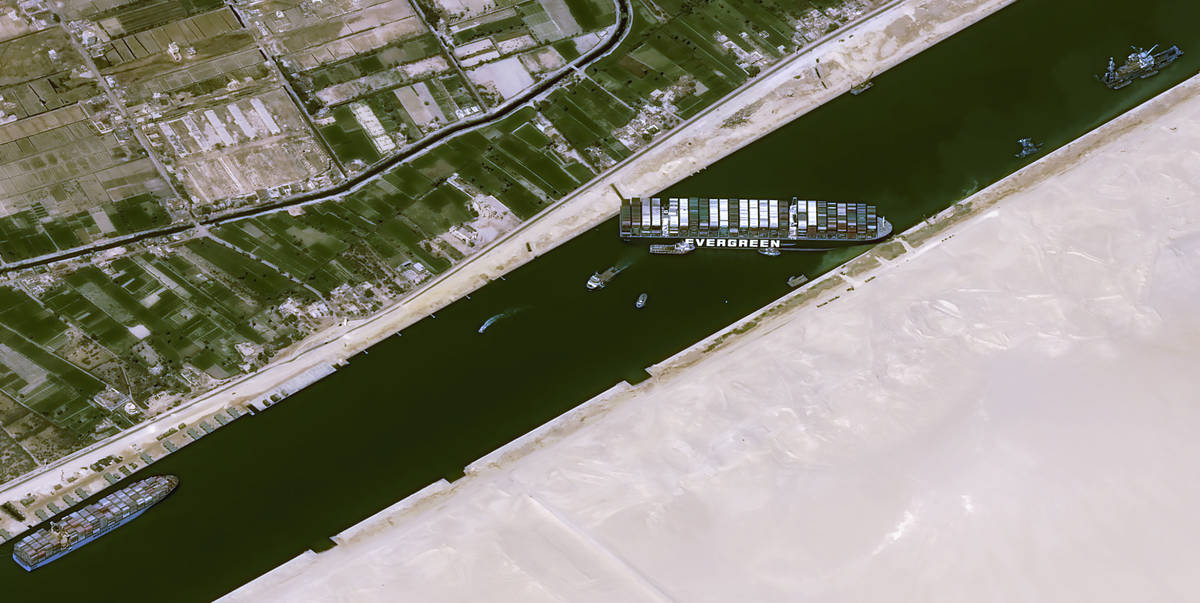 This satellite image from Cnes2021, Distribution Airbus DS, shows the cargo ship MV Ever Given ...