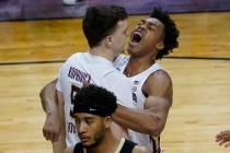 Florida State center Balsa Koprivica (5) gets a hug from teammate Scottie Barnes, right, after ...