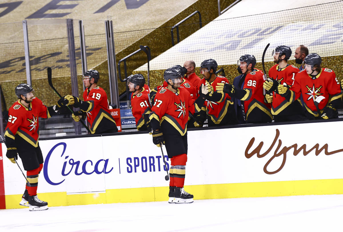 Golden Knights' Max Pacioretty (67) celebrates his goal with teammates during the first period ...