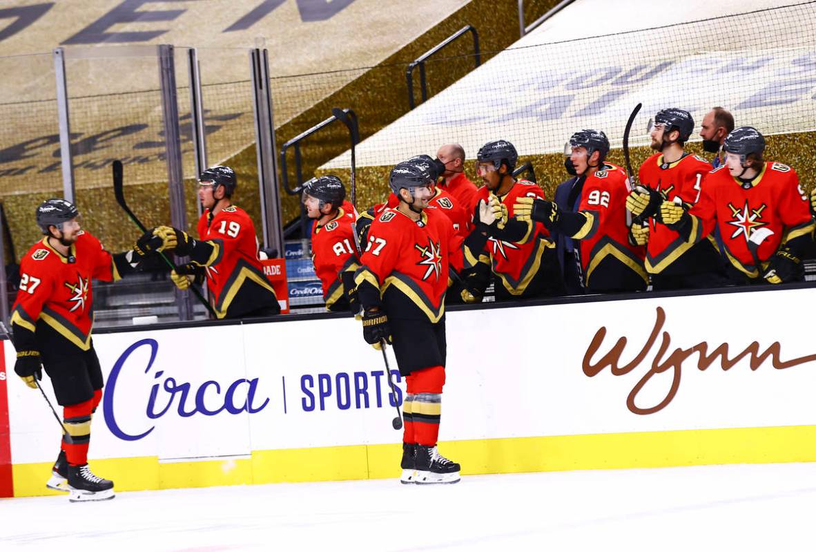 Golden Knights' Max Pacioretty (67) celebrates his goal with teammates during the first period ...
