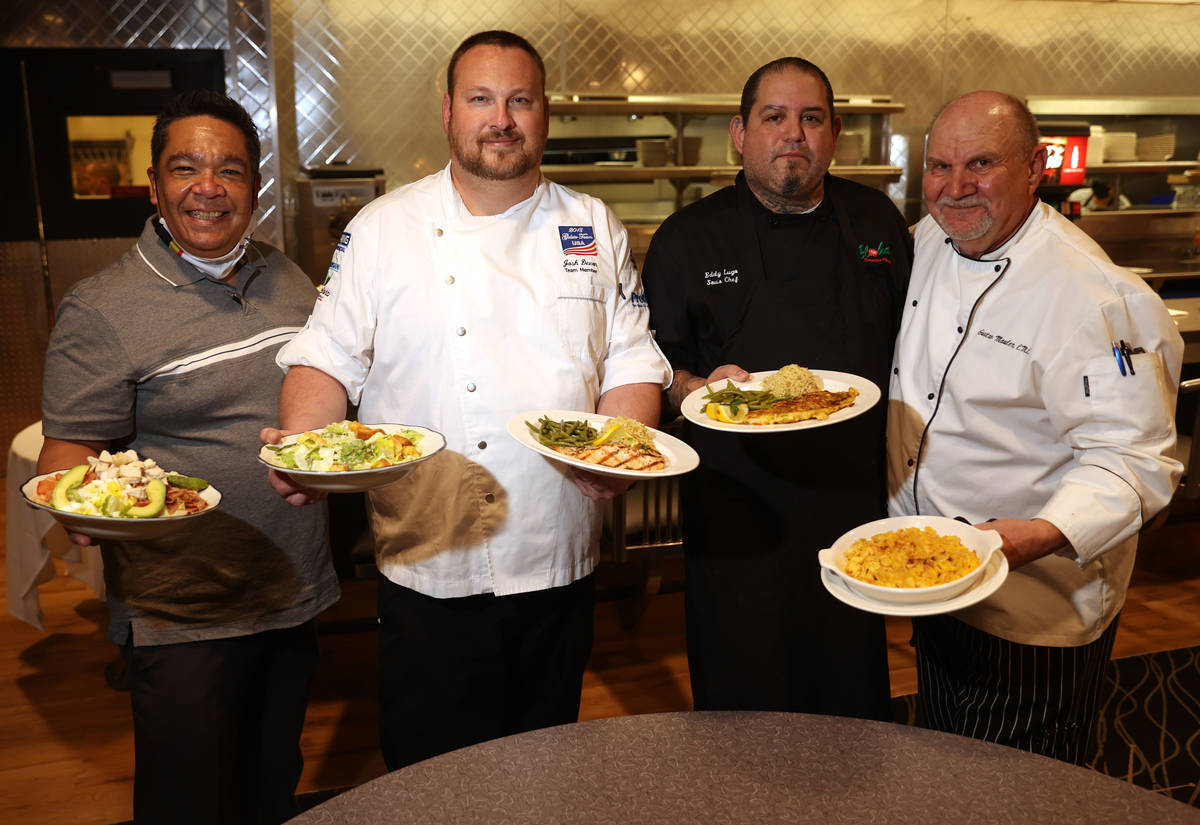 Food and Beverage Manager Chris Sjafiroeddin with the Cobb Salad, from left, Chef Josh Vevon wi ...