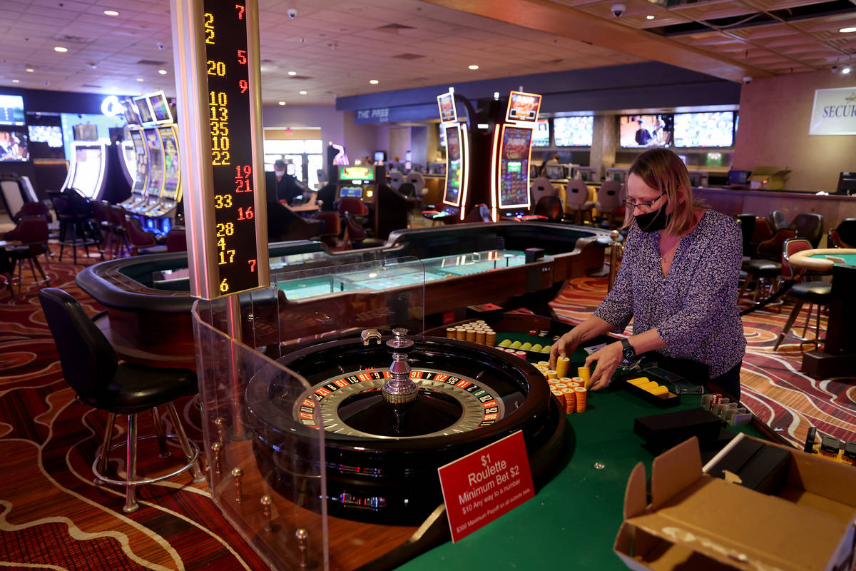Casino Manager Rhonda Westfall sets up roulette chips at The Pass on historic Water Street in d ...