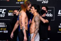 Opponents Sean O'Malley and Thomas Almeida of Brazil face off during the UFC 260 weigh-in at UF ...