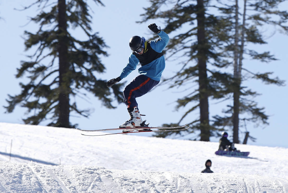 A skier makes a jump at the Sierra At Tahoe ski resort near Echo Summit , Calif., in January 20 ...