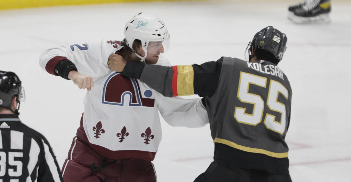 Colorado Avalanche defenseman Dan Renouf (2) fights Vegas Golden Knights right wing Keegan Kole ...