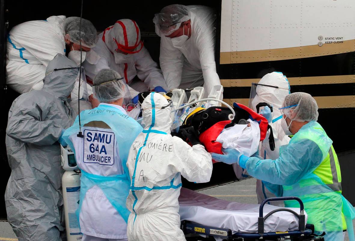 FILE- In this March 19, 2021, file photo, a patient from the Paris region and affected by the C ...