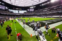 Las Vegas Raiders players run on to the field for the start of their home opening NFL game agai ...