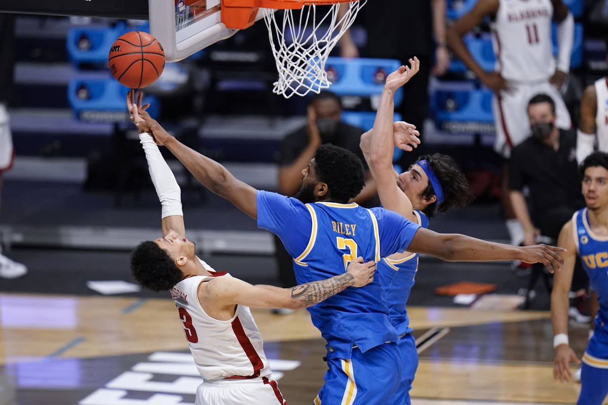 UCLA forward Cody Riley (2) blocks a Alabama guard Jahvon Quinerly (13) shot in overtime of a S ...