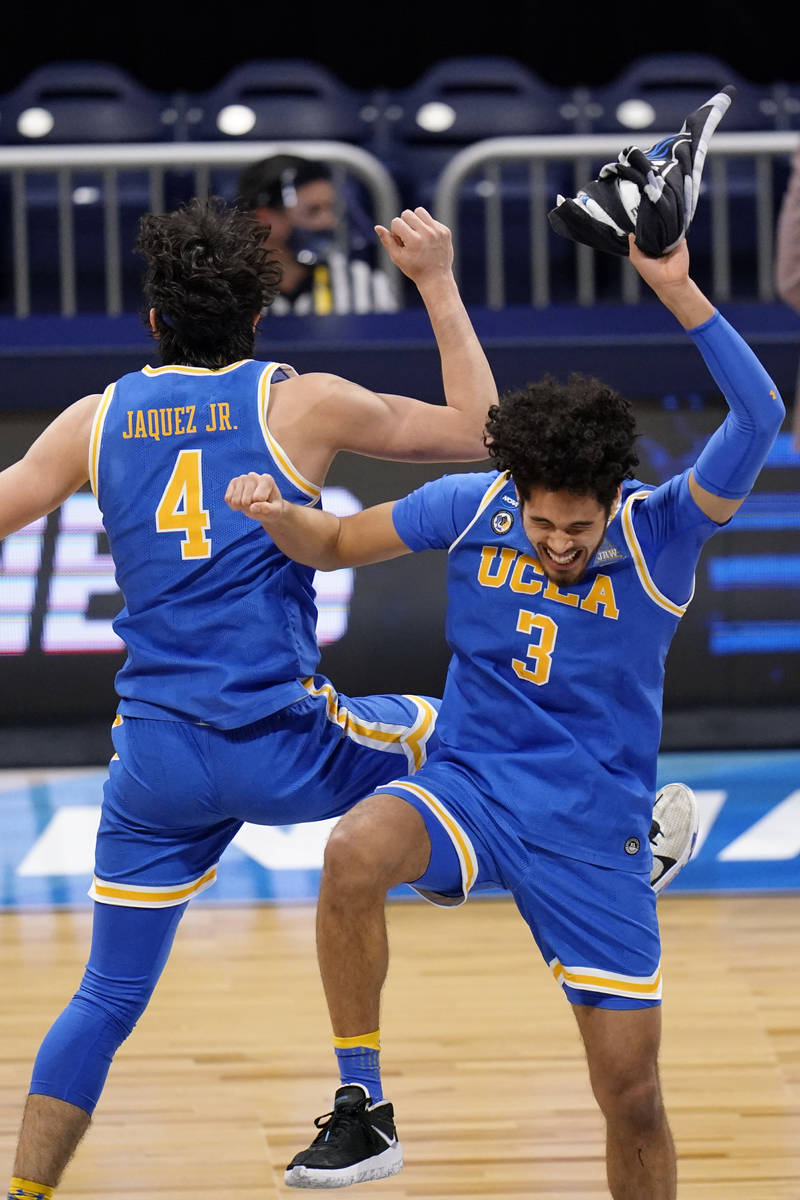 UCLA guard Jaime Jaquez Jr. (4) and Johnny Juzang (3) celebrate after beating Alabama 88-86 in ...