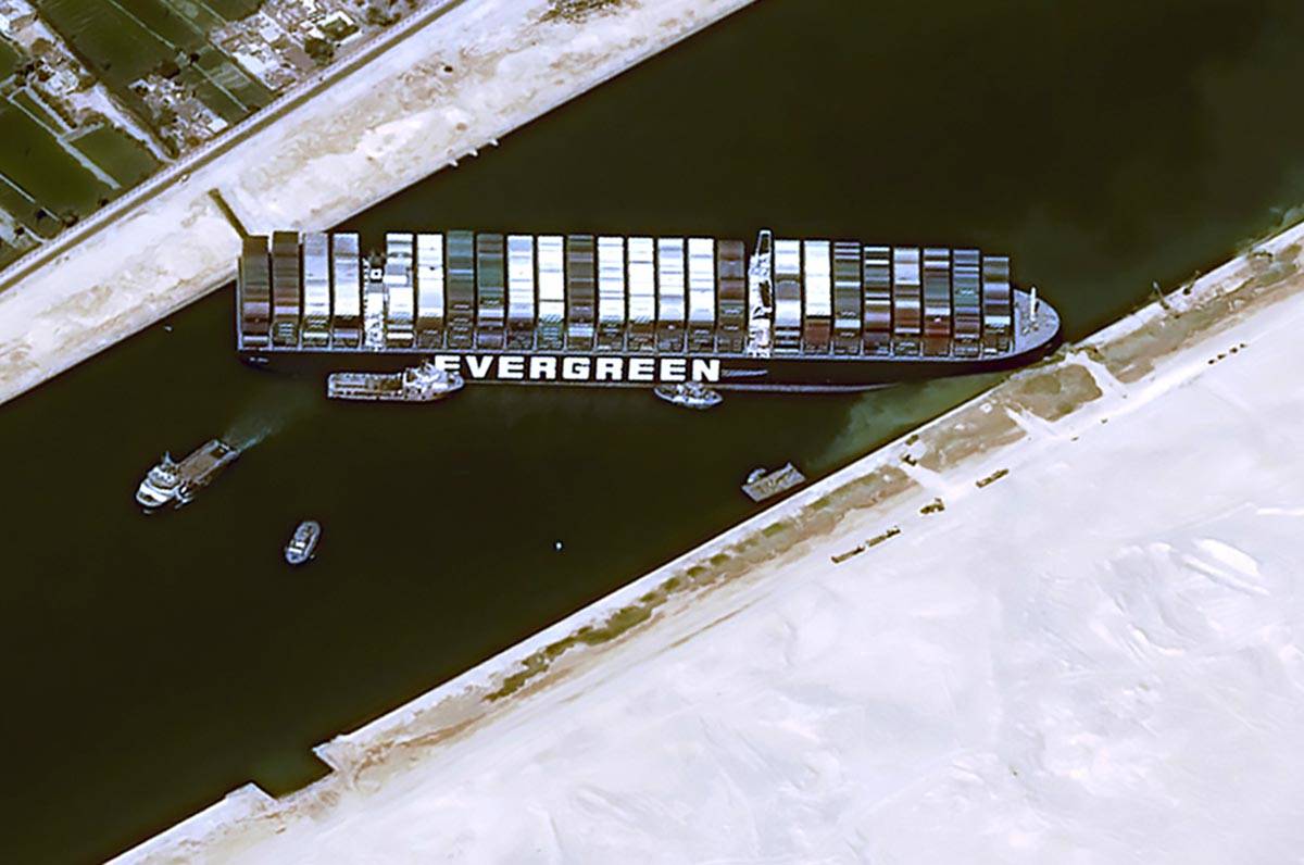 This satellite image from Cnes2021, Distribution Airbus DS, shows the cargo ship MV Ever Given ...