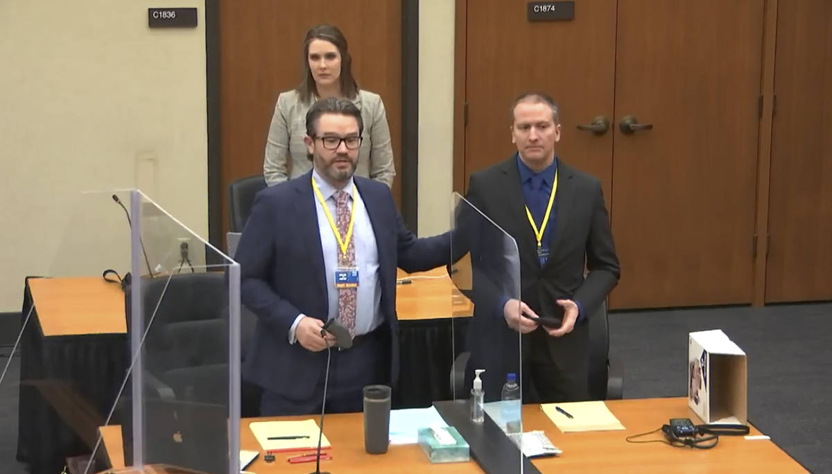 FILE - In this image taken from video, defense attorney Eric Nelson, left, defendant and former ...