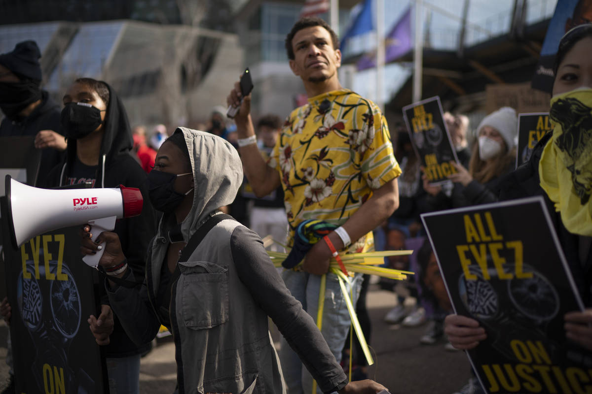 Marchers chant outside US Bank Stadium in Minneapolis Sunday, March 28, 2021, on the eve of the ...