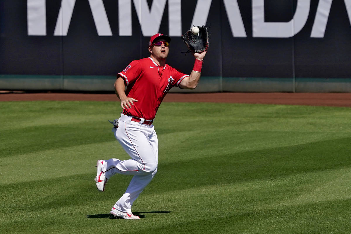 Los Angeles Angels' Mike Trout fields a fly-out hit by Chicago Cubs' Matt Duffy during the seco ...