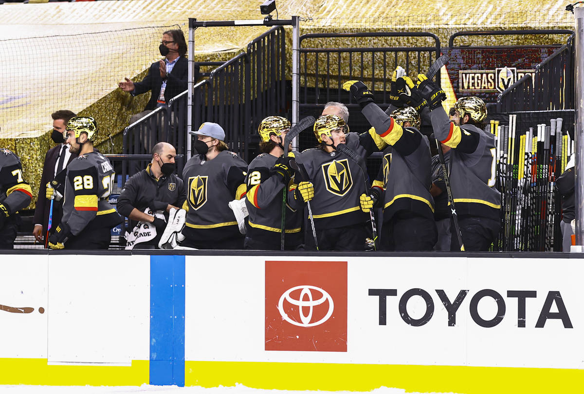 The Golden Knights celebrate a goal by Alec Martinez, not pictured, during the third period of ...
