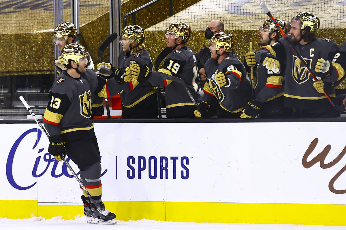 Golden Knights' Alec Martinez (23) celebrates his goal with teammates during the third period o ...