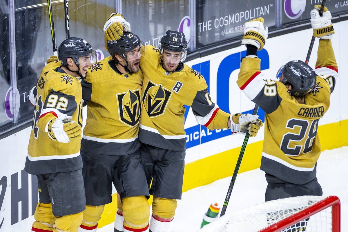 Golden Knights defenseman Alec Martinez (23) is celebrated by teammates for. Goal over the San ...