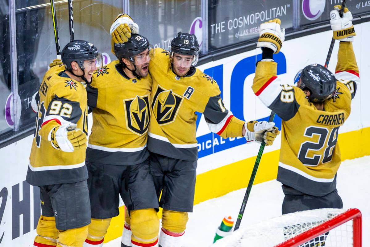 Golden Knights defenseman Alec Martinez (23) is celebrated by teammates for. Goal over the San ...