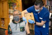 Leonardo Terravova, 66, receives the COVID-19 vaccine from Touro University Nevada physician as ...