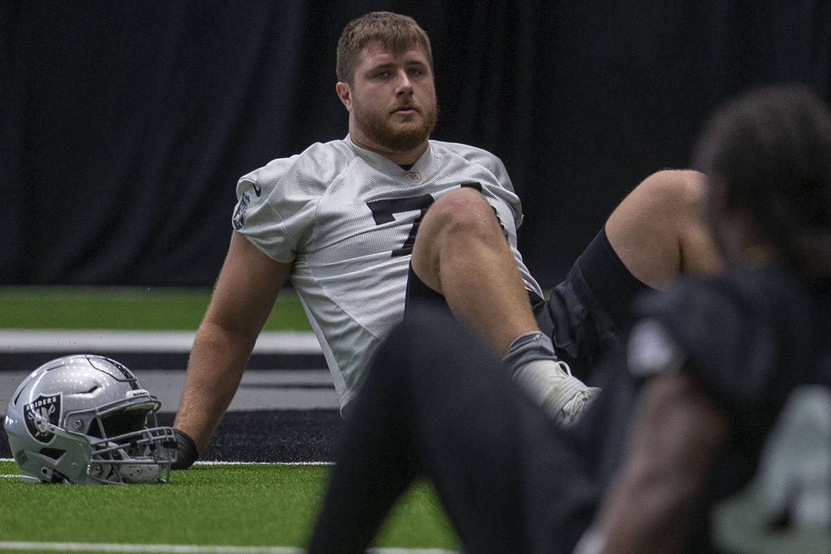 Las Vegas Raiders offensive tackle Kolton Miller (74) stretches during a practice session at th ...