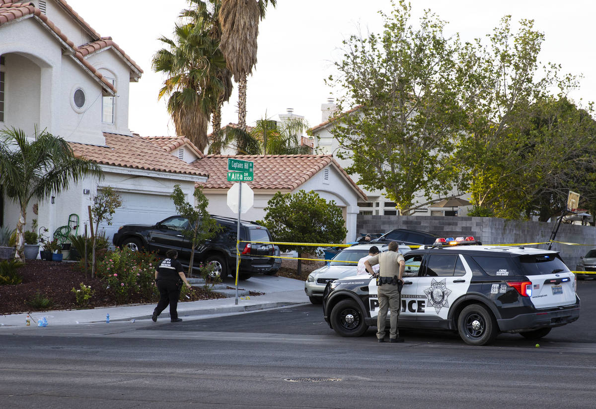 The Metropolitan Police Department investigate the fatal shooting of a young man outside a hous ...