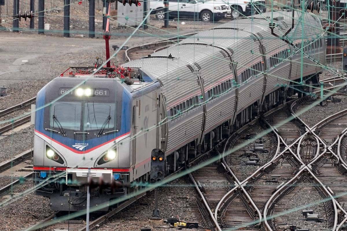 An Amtrak train departs 30th Street Station in Philadelphia, Wednesday, March 31, 2021. Looking ...