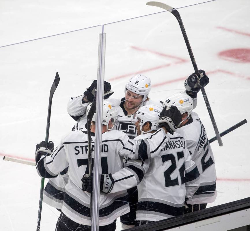 The Kings celebrate a point scored by left wing Andreas Athanasiou (22) during the first period ...