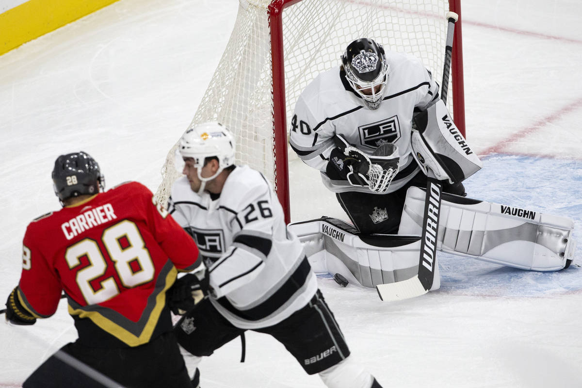 Kings goaltender Calvin Petersen (40) saves a shot on goal by Golden Knights left wing William ...