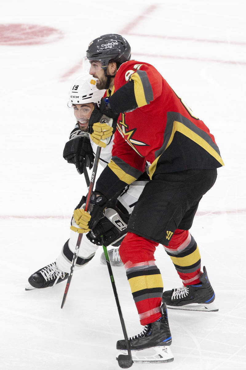 Golden Knights right wing Alex Tuch (89) and Kings right wing Alex Iafallo (19) make contact du ...