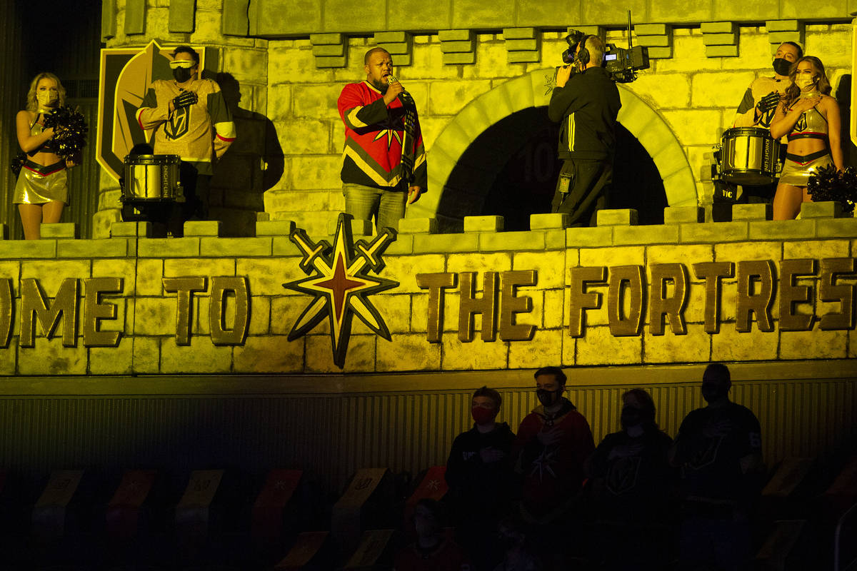 Carnell Johnson sings the national anthem before an NHL hockey game between the Golden Knights ...