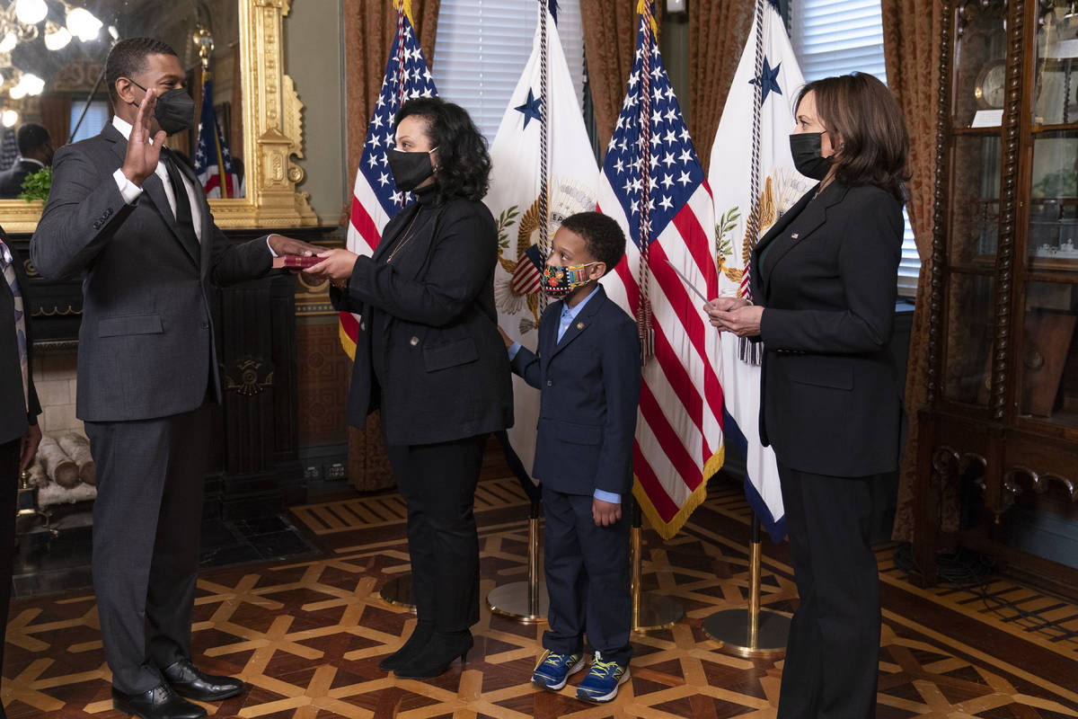 Vice President Kamala Harris, right, administers the ceremonial swearing-in of Michael Regan as ...