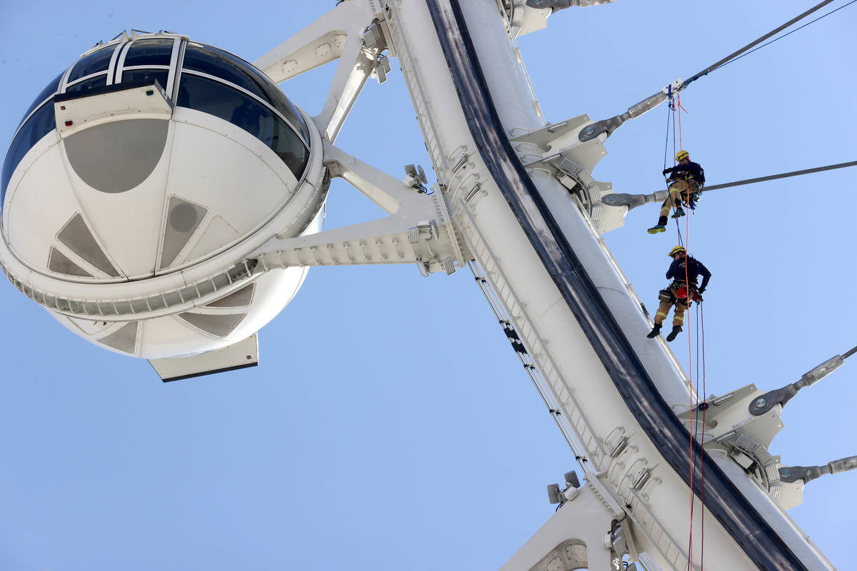 City of Las Vegas Fire & Rescue and Clark County Fire Department firefighters perform high- ...