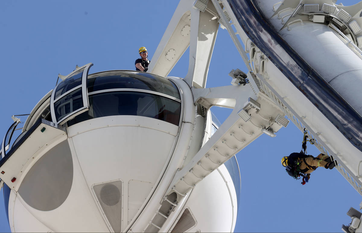 City of Las Vegas Fire & Rescue and Clark County Fire Department firefighters perform high- ...