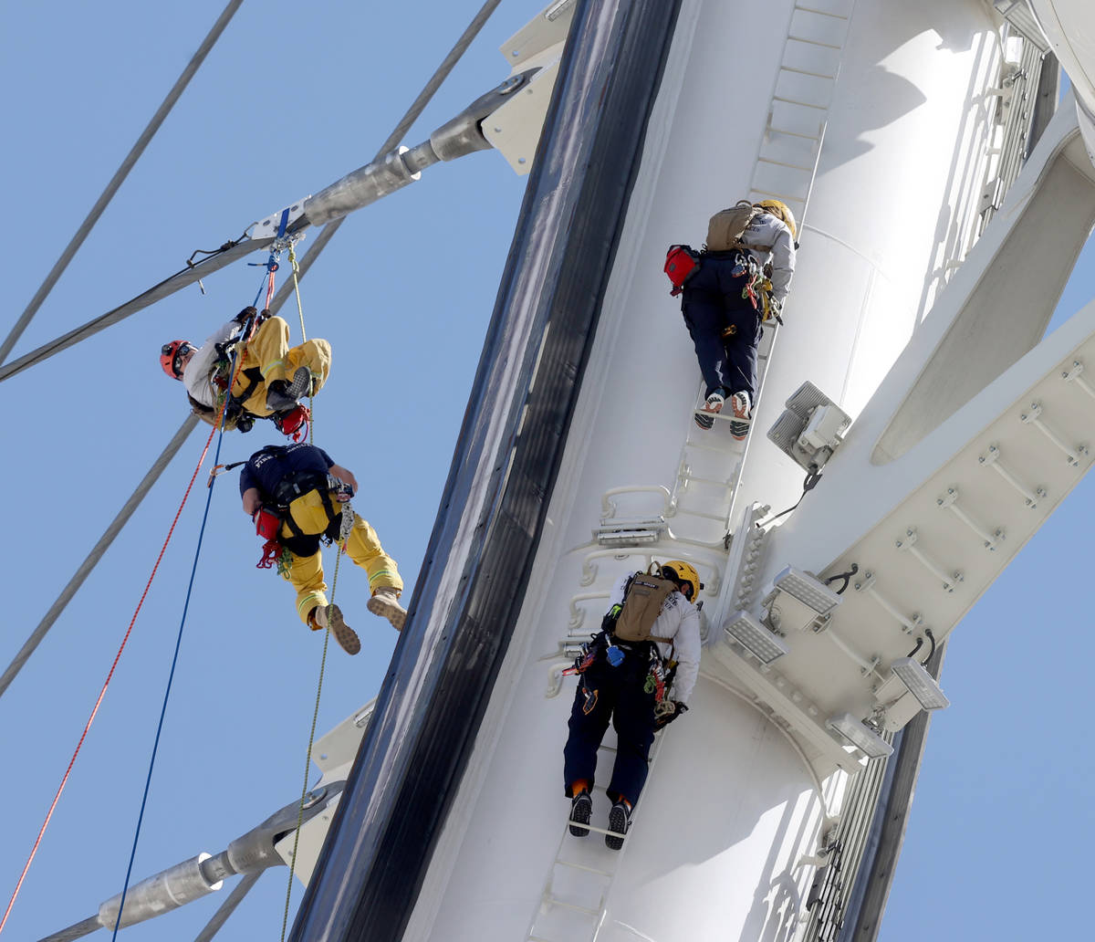 City of Las Vegas Fire & Rescue and Clark County Fire Department firefighters perform high- ...