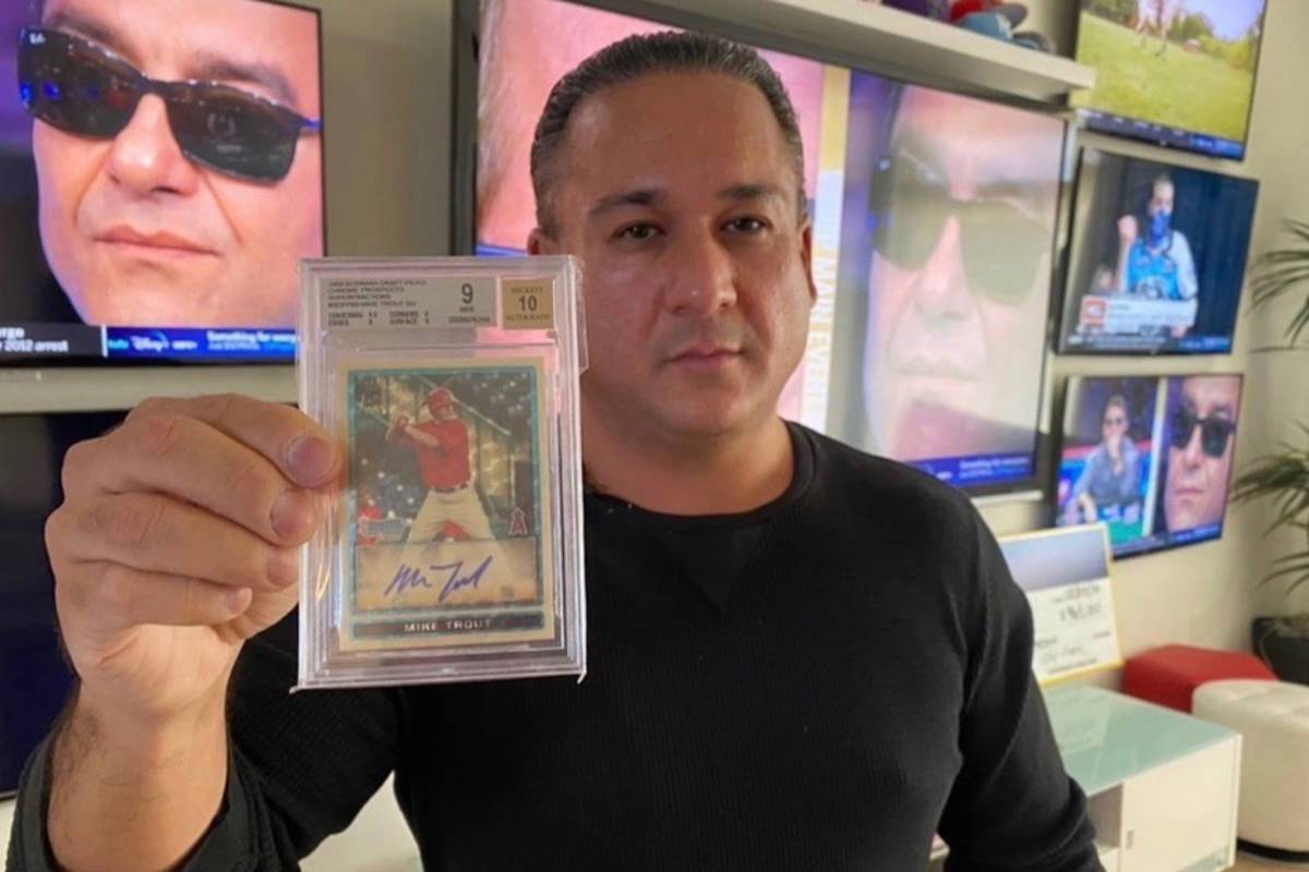 Las Vegas based sports betting consultant Dave Oancea displays a rare Mike Trout baseball card ...