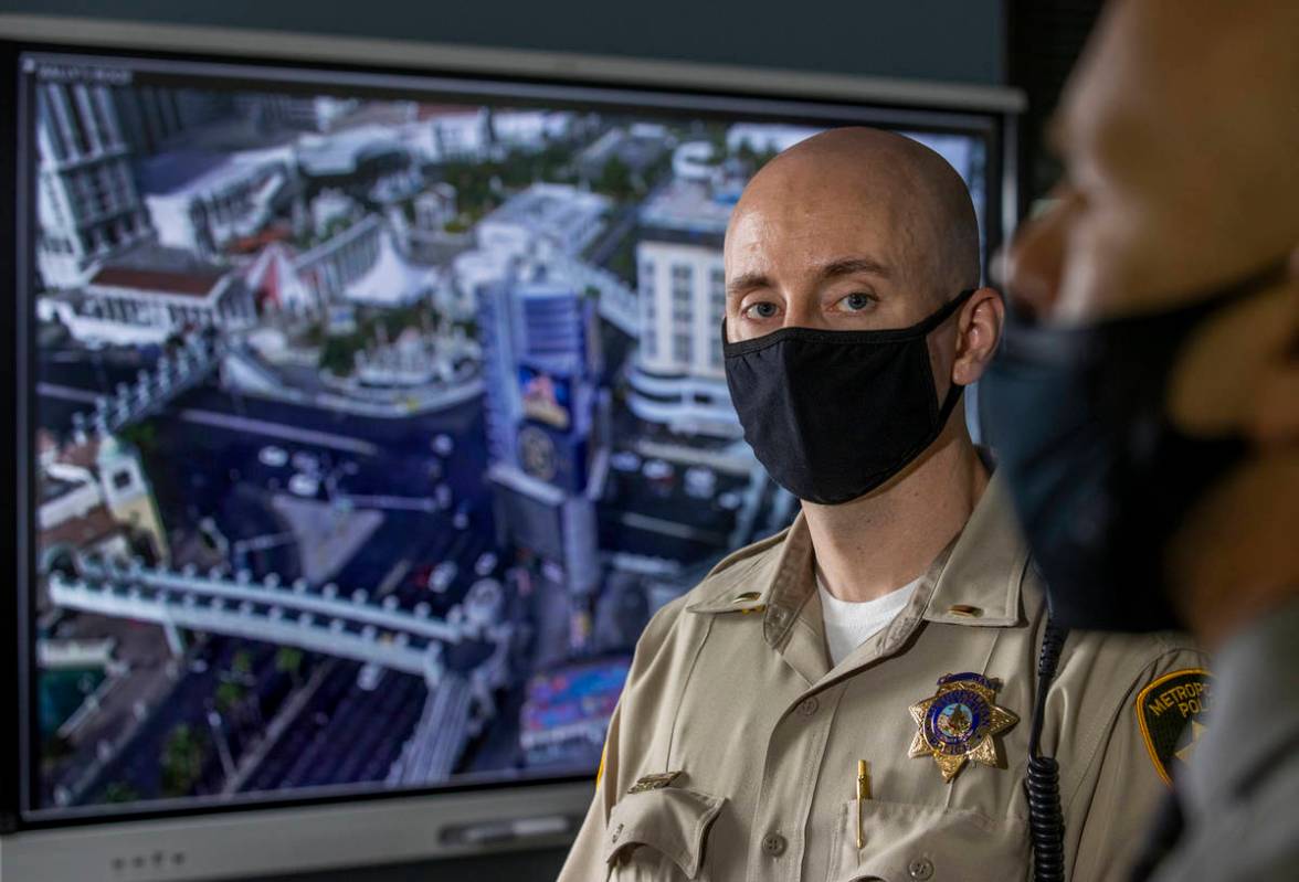 Lt. Bill Steinmetz, left, looks to PIO Larry Hadfield commenting on the ShotSpotter Dispatch pr ...