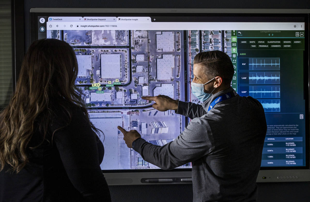 Sgt. Kyle Downie, right, confers with specialist Amber Stringer while using an interactive elec ...