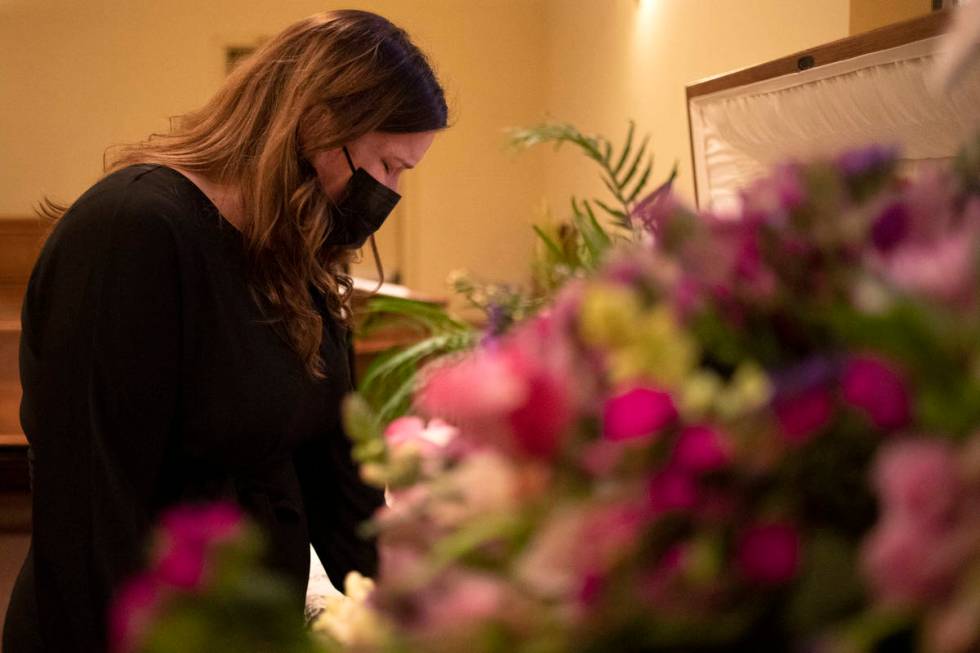 Sheila Hoonsan steps away from her family to have a moment alone with her mom's body. "I'm sorr ...