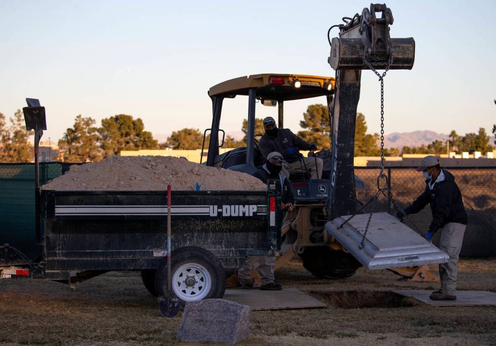 Staff at Davis Memorial Park bury 23-year-old Skyler Morales in Las Vegas. More than 5,300 peop ...